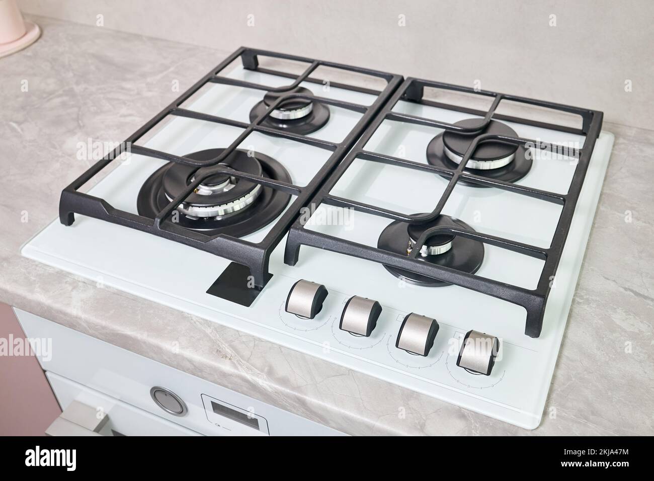 Modern hob gas stove made of tempered white glass using natural gas or