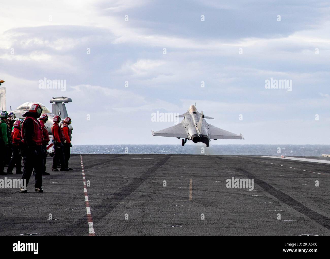 221123-N-MW880-1430 IONIAN SEA (Nov. 23, 2022) A French Rafale fighter jet is launched off the flight deck of the Nimitz-class aircraft carrier USS George H.W. Bush (CVN 77), during multi-carrier operations between the George H.W. Bush Carrier Strike Group (CSG), Charles de Gaulle CSG, and the Italian Cavour CSG Nov. 23, 2022. The George H.W. Bush CSG is on a scheduled deployment in the U.S. Naval Forces Europe area of operations, employed by U.S. Sixth Fleet to defend U.S., allied, and partner interests. (U.S. Navy photo by Mass Communication Specialist 3rd Class Samuel Wagner) Stock Photo