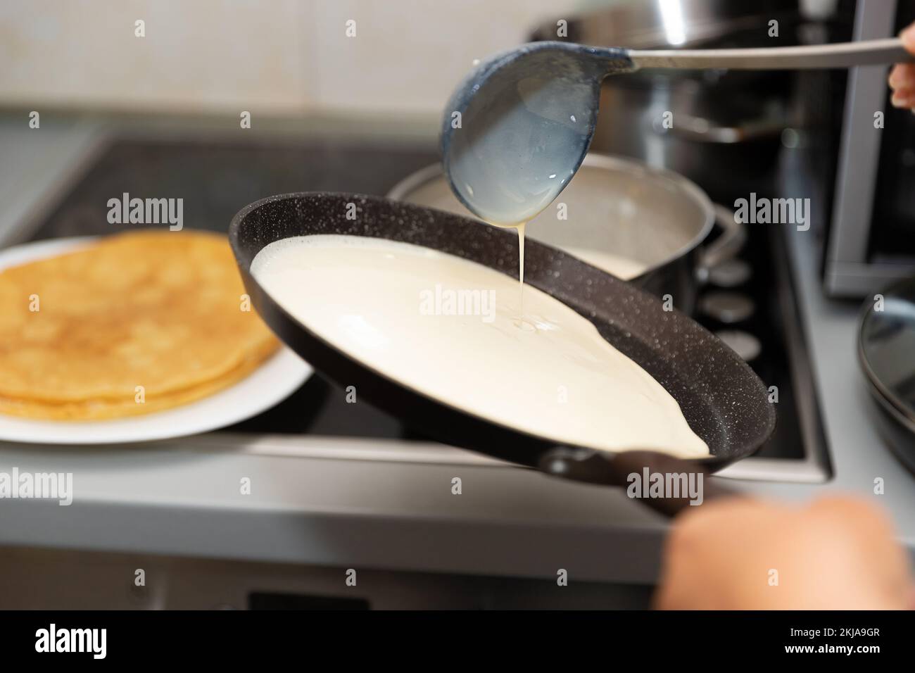The process of cooking pancakes at home Stock Photo