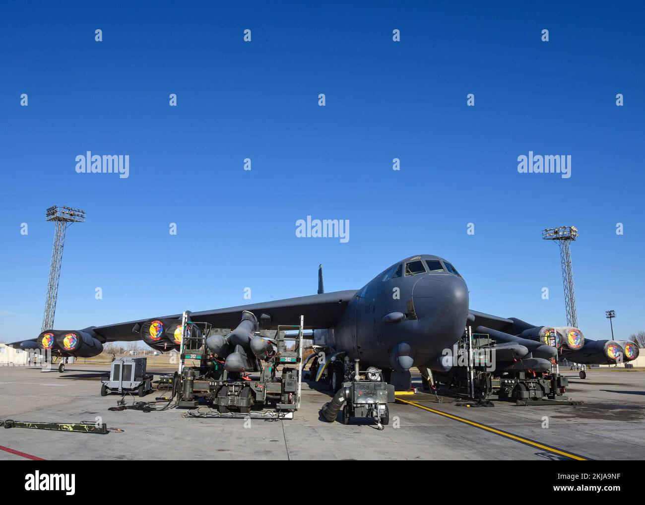Team Minot Airmen load weapons into a B52H Stratofortress during