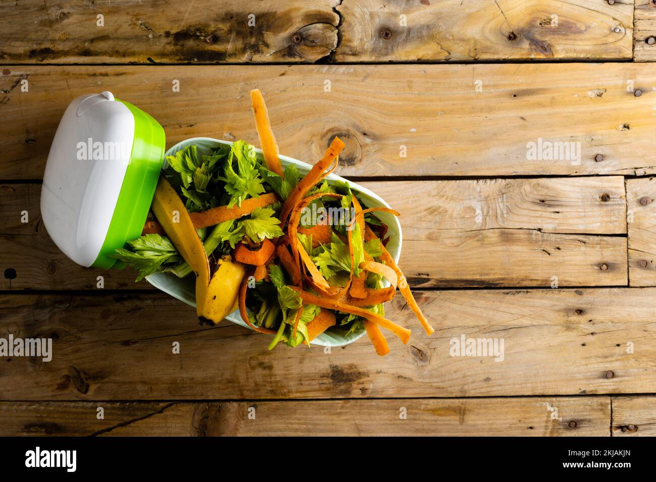 Overhead of organic fruit and vegetable food waste in kitchen composting bin Stock Photo