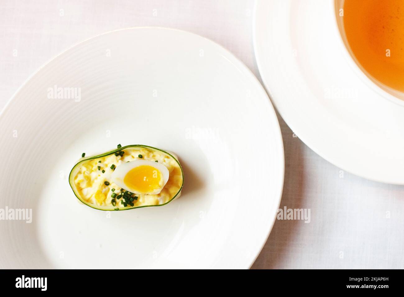 An egg sandwich, wrapped in a thin slice of cucumber and photographed from above, served at high tea at the Mandarin Oriental's Clipper Lounge, 2013 Stock Photo