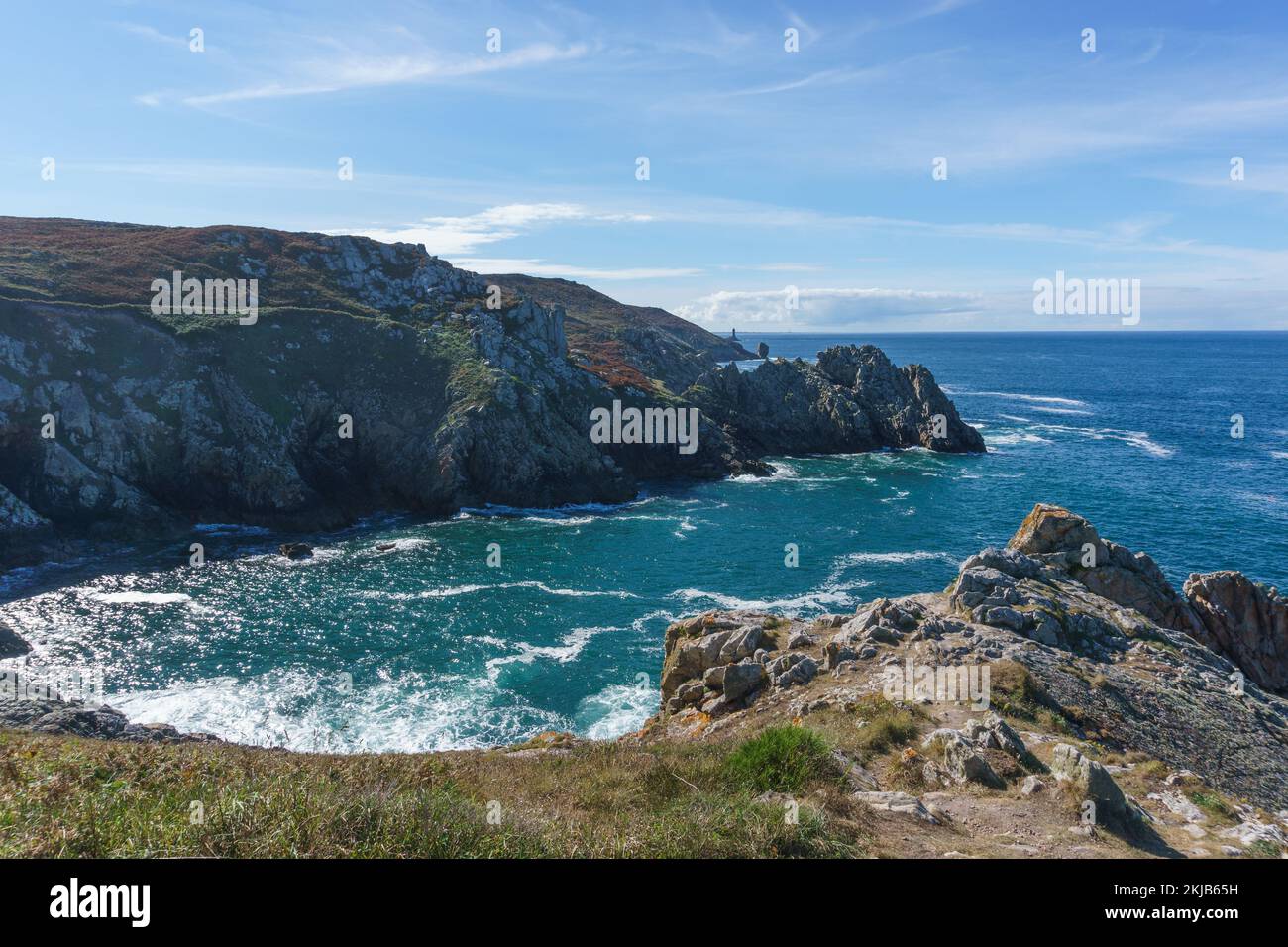 Coastline with hiking path and view to Pointe du Raz and Vieille lighthouse, Plogoff, Finistere, Brittany, France Stock Photo