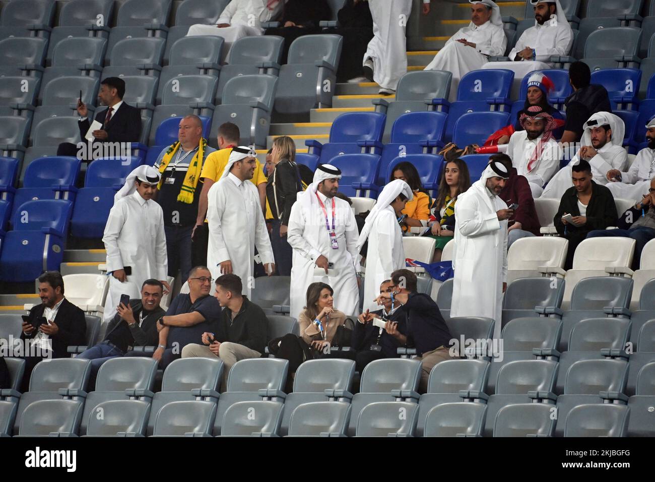 Qatarar in traditional robes on the tribune. Empty seats, not full