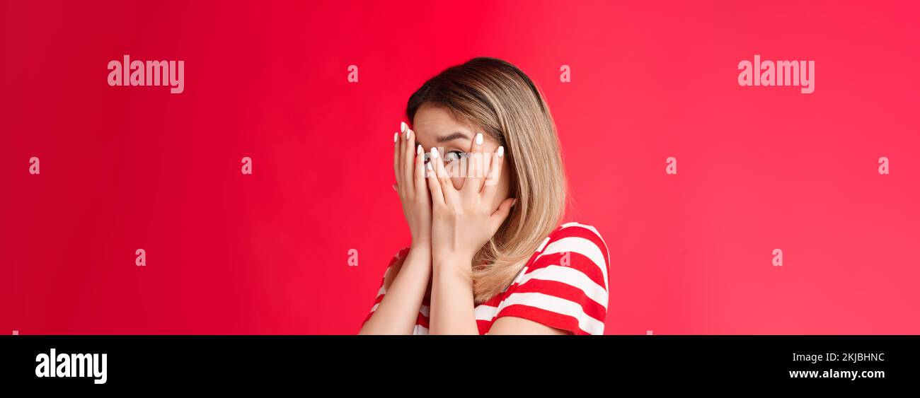 Not looking swear. Cute peeking young girl close eyes palms turn away