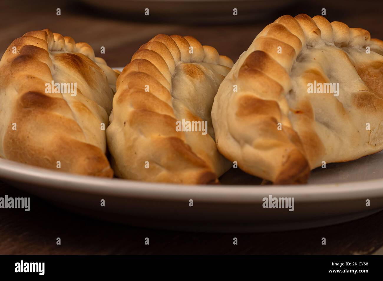 Traditional Argentinean empanadas pie on table, meat Chicken and
