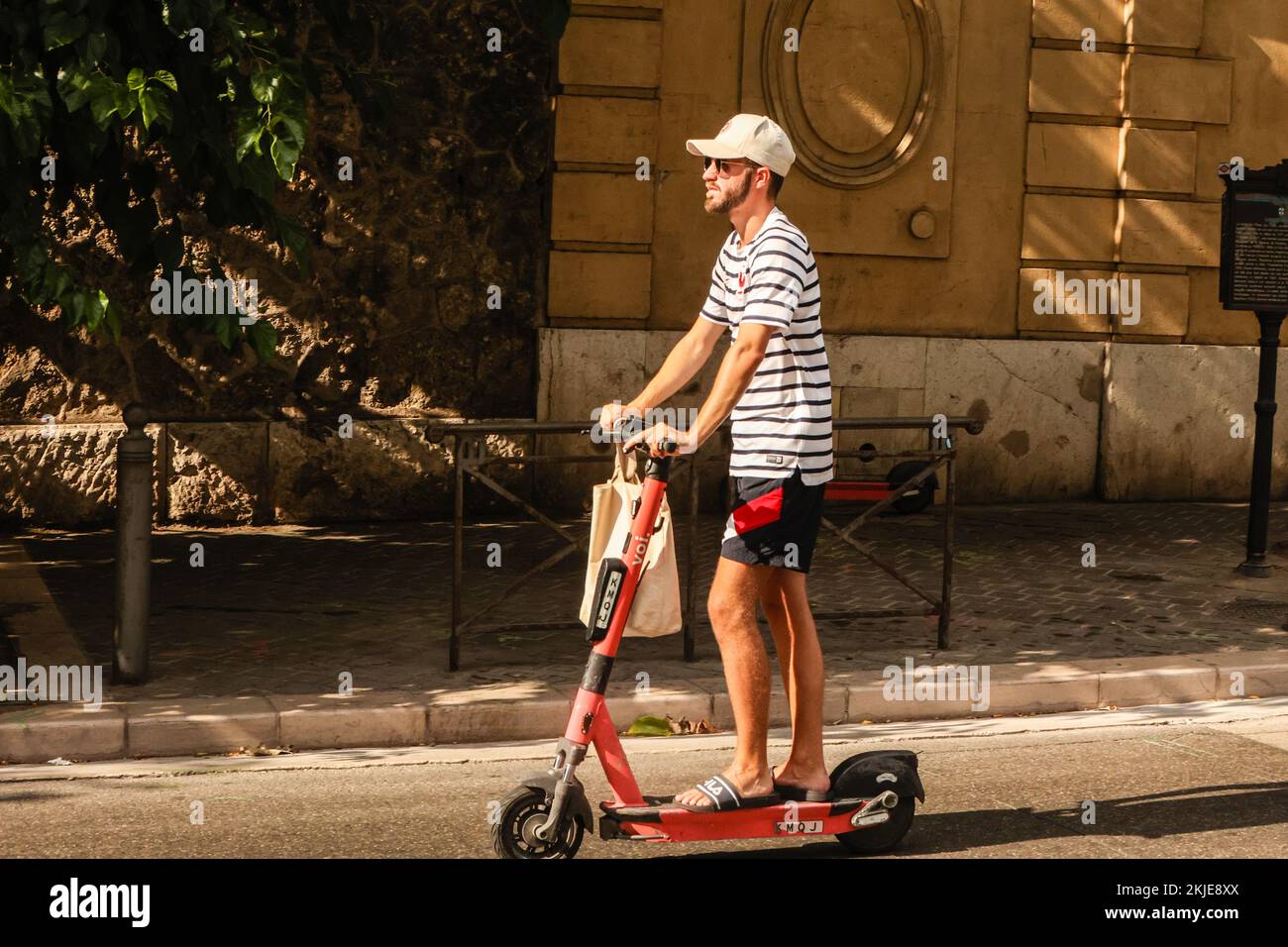 Riding,on,electric scooter,electric scooters,scooter,during,Heatwave,hot,sunny,days,record,temperatures,cool  off,at,near,beach,Plage des Catalans,Marseille,Marseilles,Commune in,  Bouches-du-Rhône, the second largest city of France,Marseille, is the ...
