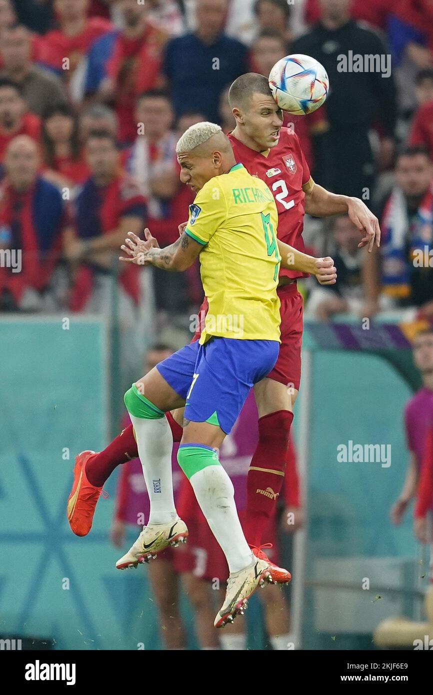 LUSAIL, QATAR - NOVEMBER 24: Player of Brazil Richarlison fights for the ball with player of Serbia Strahinja Pavlovic during the FIFA World Cup Qatar 2022 group G match between Brazil and Serbia at Lusail Stadium on November 24, 2022 in Lusail, Qatar. (Photo by Florencia Tan Jun/PxImages) Credit: Px Images/Alamy Live News Stock Photo