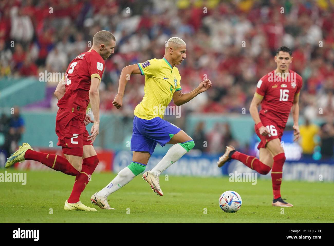 LUSAIL, QATAR - NOVEMBER 24: Player of Brazil Richarlison runs ahead of player of Serbia Strahinja Pavlovic during the FIFA World Cup Qatar 2022 group G match between Brazil and Serbia at Lusail Stadium on November 24, 2022 in Lusail, Qatar. (Photo by Florencia Tan Jun/PxImages) Credit: Px Images/Alamy Live News Stock Photo