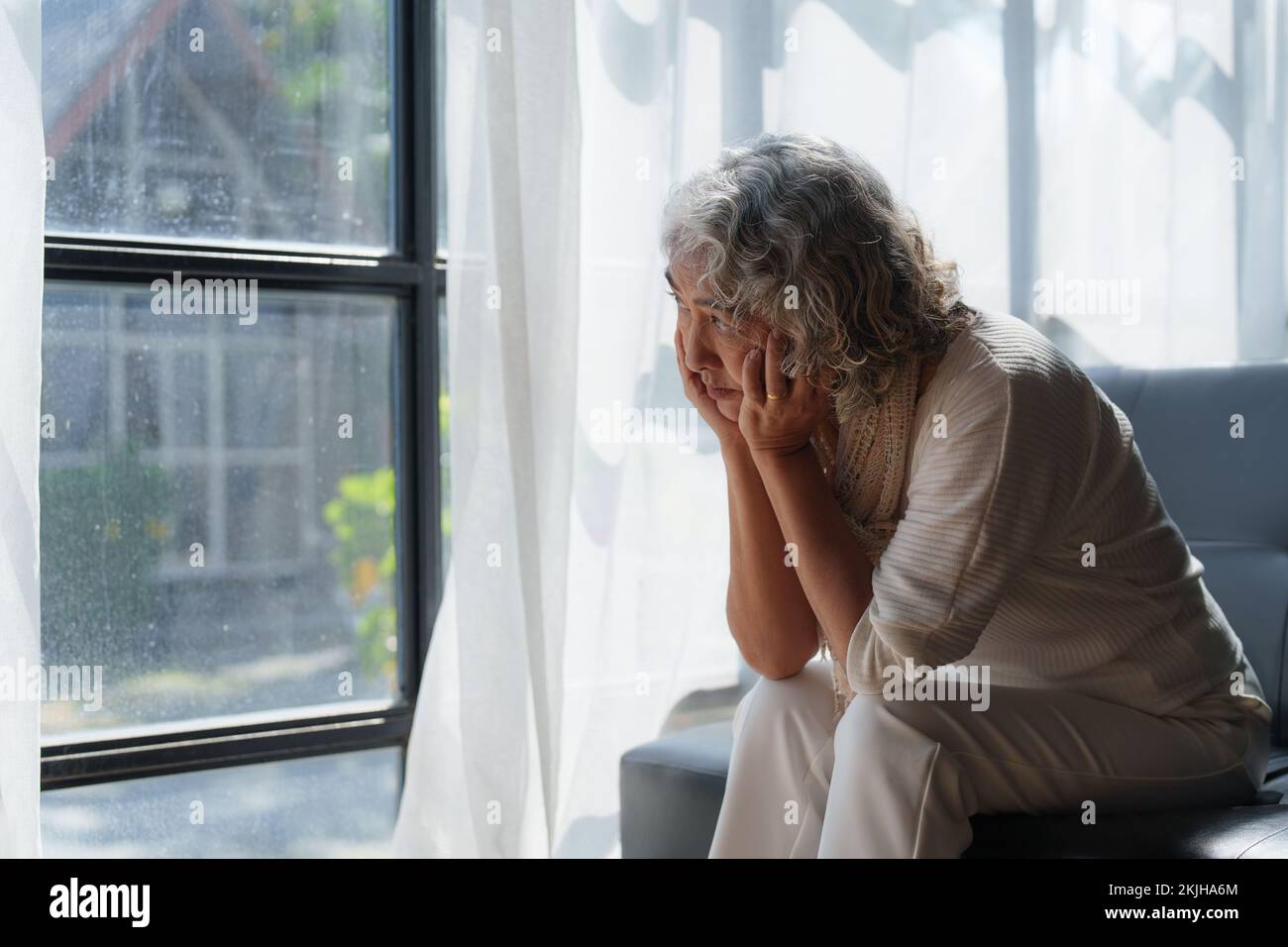 Pensive older woman lonely old senior in is home Stock Photo
