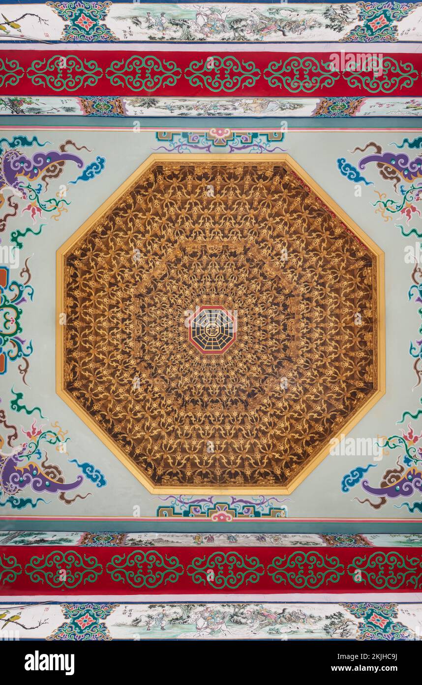 Samut Prakan, Thailand - Nov 18, 2022 : Elaborate sculptures of octagonal shape on ceiling design of Wat thamma katanyu or Tham Katanya Shrine Foundat Stock Photo