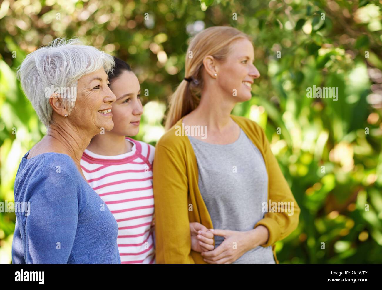 Enjoying a wonderful day in the outdoors. three generations of family women standing outdoors. Stock Photo
