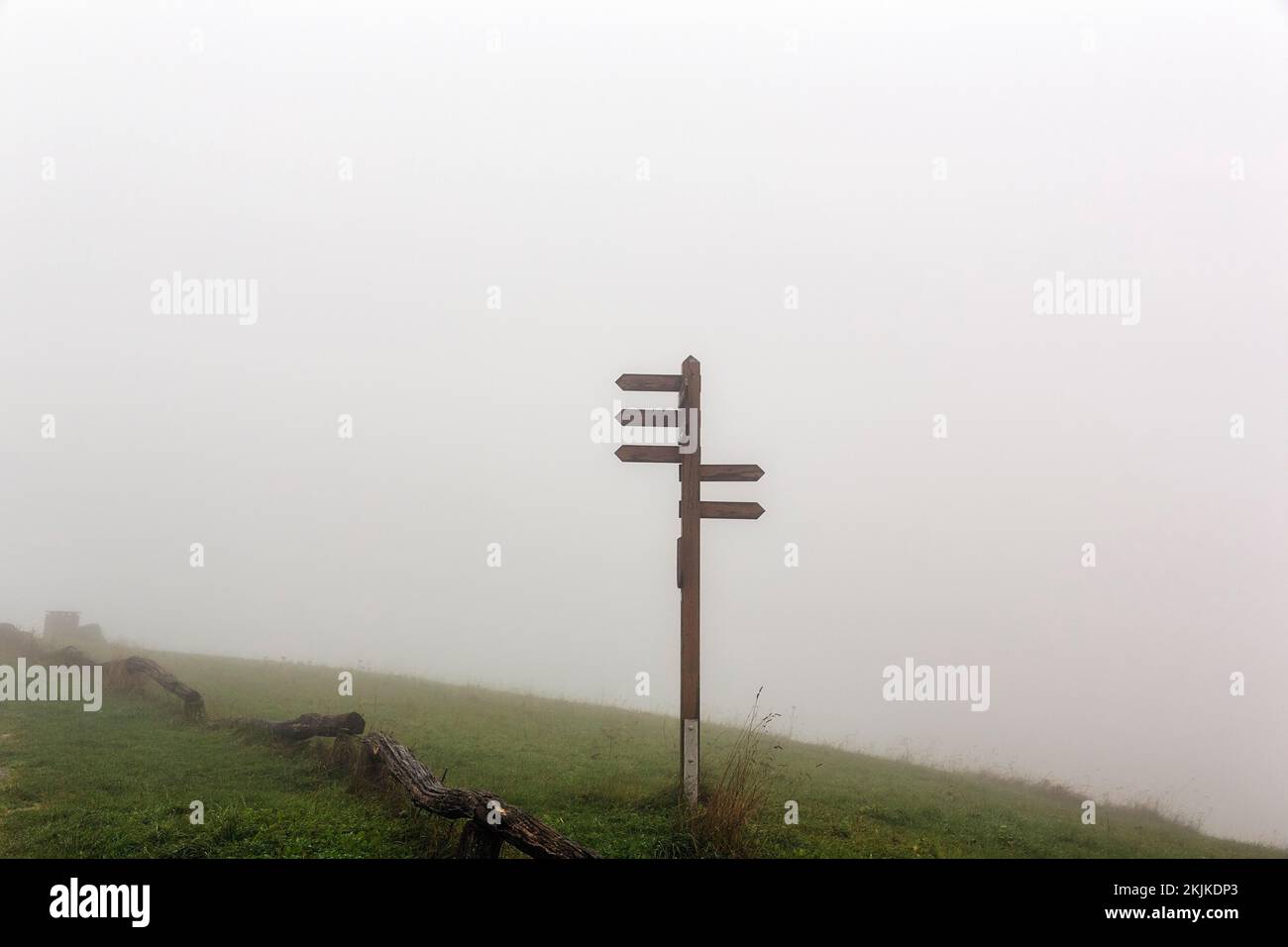 Signposts for hiking trails on mountain peak Köterberg in fog, dreary autumn weather, Lügde, Weserbergland, North Rhine-Westphalia, Germany, Europe Stock Photo