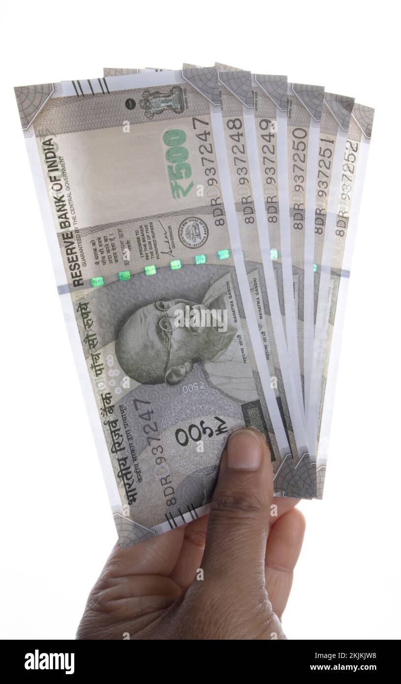 Indian Currency holding in a hand Stock Photo