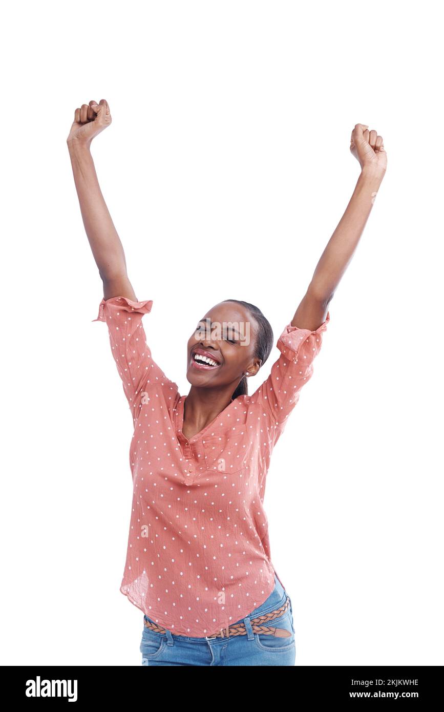 Im the best. Studio shot of a young woman with arms raised in celebration. Stock Photo