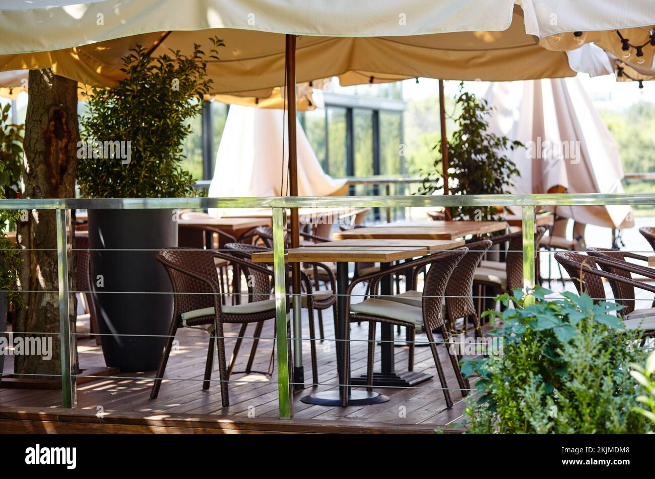 Restaurant terrace umbrella with light lamp bulbs. Modern exterior of ...