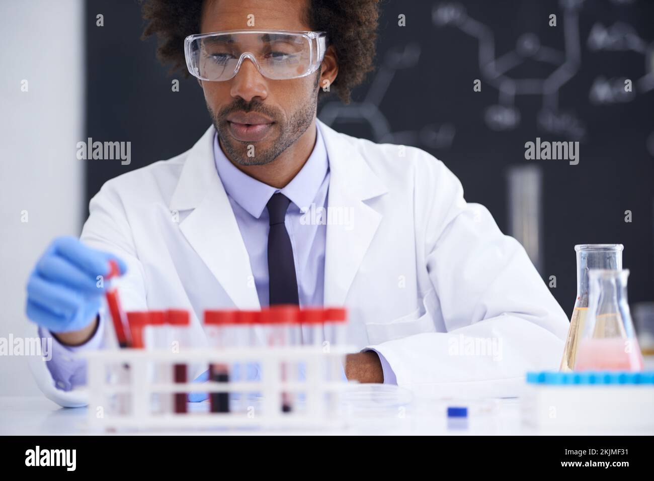 Testing your lifeblood. a male medical scientist conducting blood tests