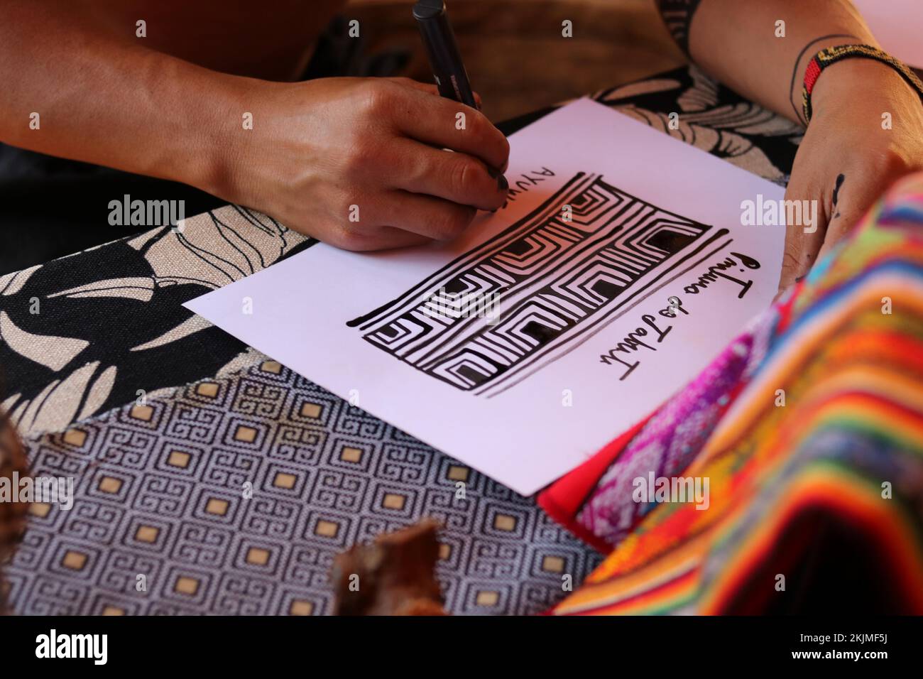 Indigenous people, man of the indigenous people Mehinako (Xingu) making traditional graphic art, Pernambuco, Brazil, South America Stock Photo