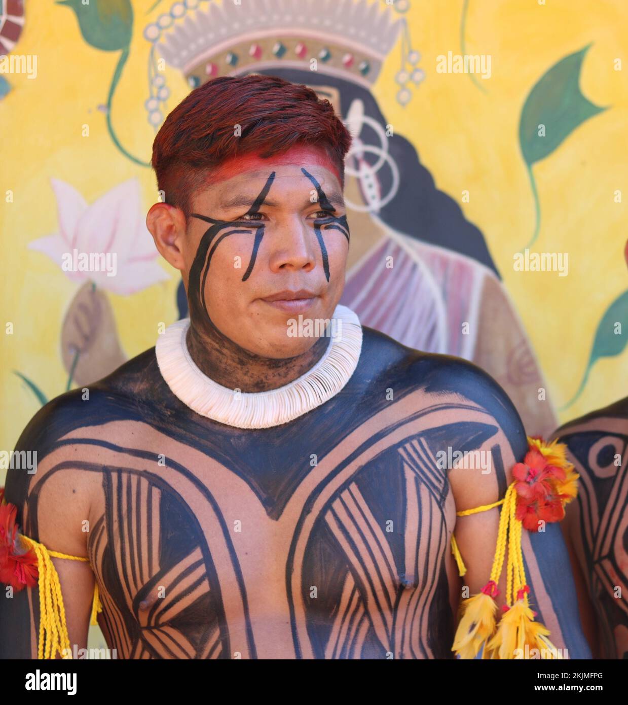 Indigenous people, man of the indigenous people Mehinako decorated with