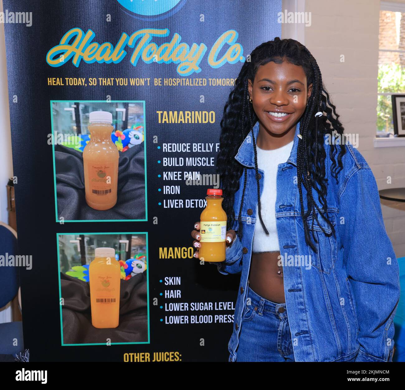 Los Angeles, California, USA. November 19th, 2022. Princess Mapp at the Heal Today company booth holds one of their juice products at the Product Hollywood & the Celebrity Gifting Suites in the Celebration of the 2022 American Music Awards at the Historic Woman's Club of Hollywood  in Los Angeles, California. Credit: Sheri Determan Stock Photo