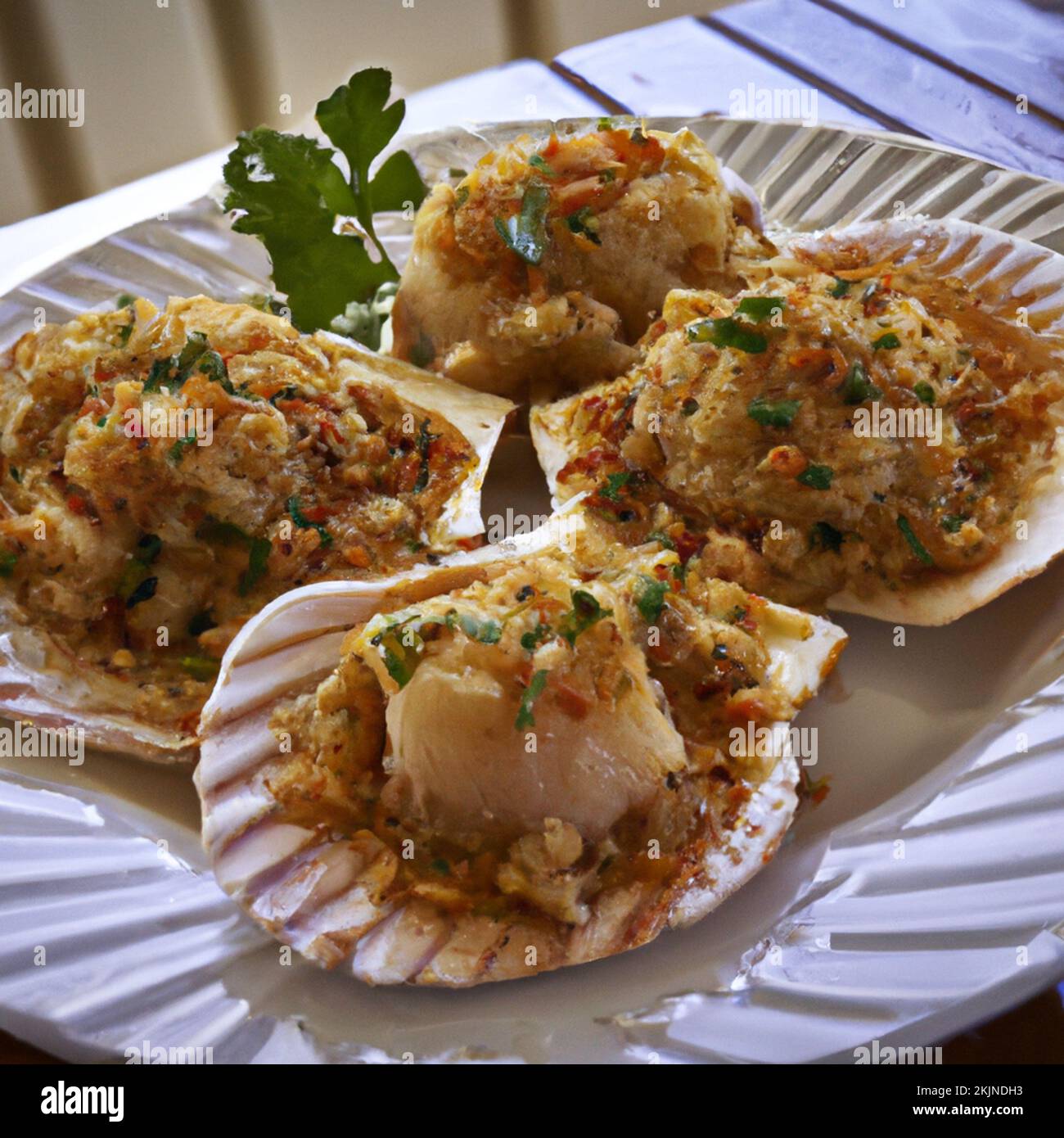 Food illustration of delicious stuffed scallops coated in breadcrumbs