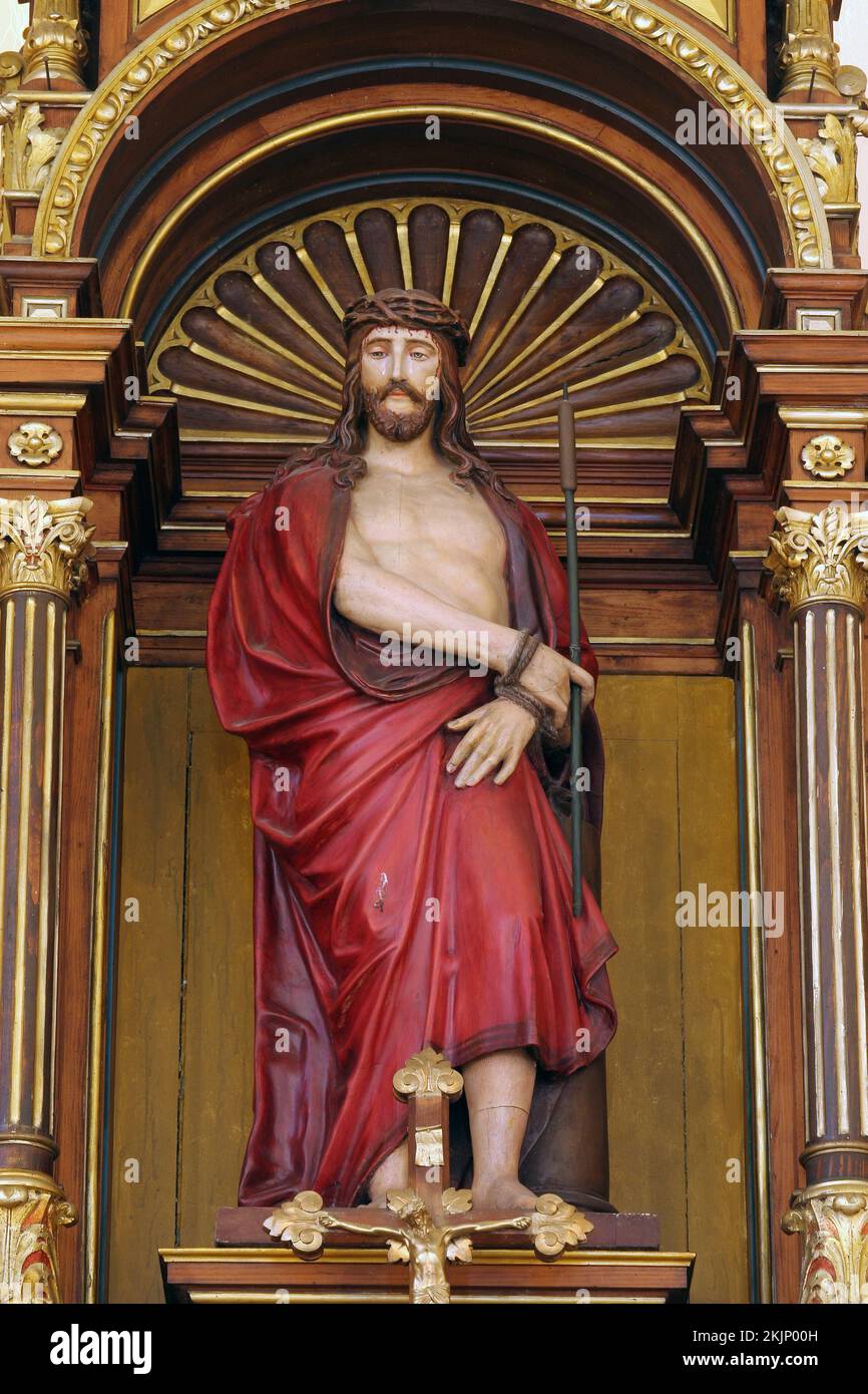 Bound Christ, statue on the main altar in the parish church Wounded Jesus in Gradec, Croatia Stock Photo