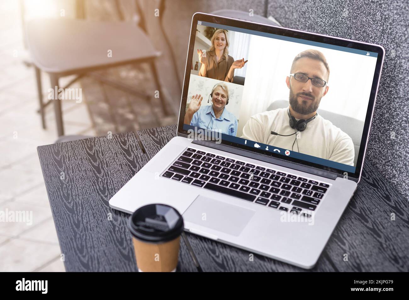 Man Working From Home Having Online Group Videoconference On Laptop Stock Photo