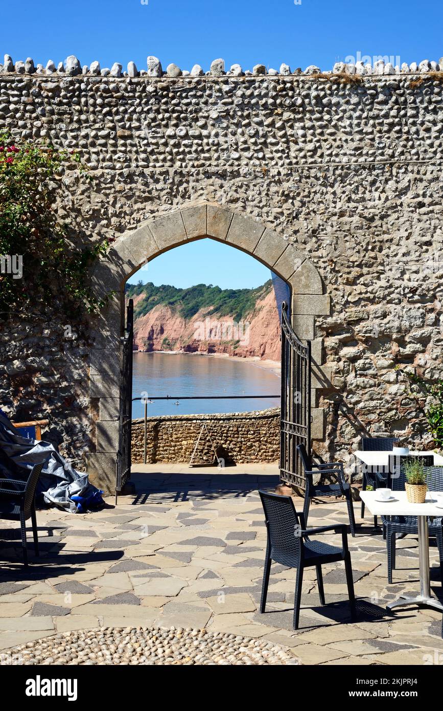 Elevated view through the arch at Connaught Gardens overlooking the sea and cliffs, Sidmouth, Devon, UK. Stock Photo