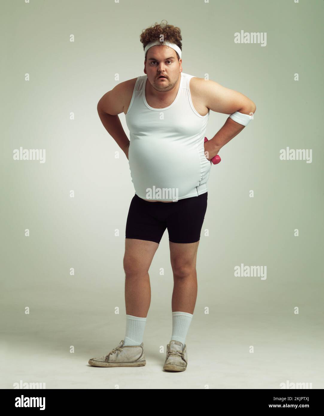 Who you calling fat. Portrait of an overweight man standing with his