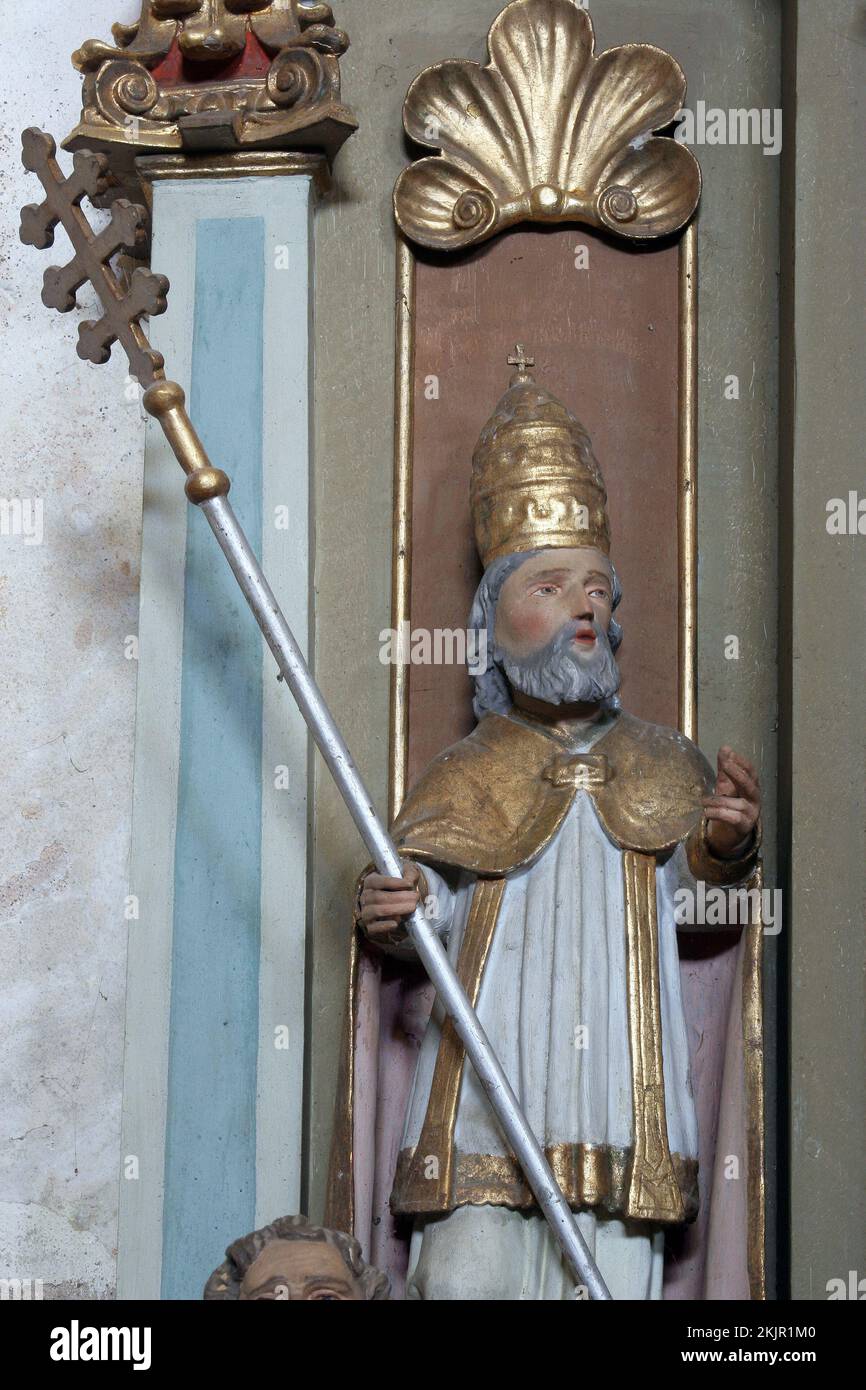 Statue of the Saint Fabian on the altar of the descent of the Holy Spirit in the parish church of St. Catherine of Alexandria in Ribnicki Kunic, Croat Stock Photo