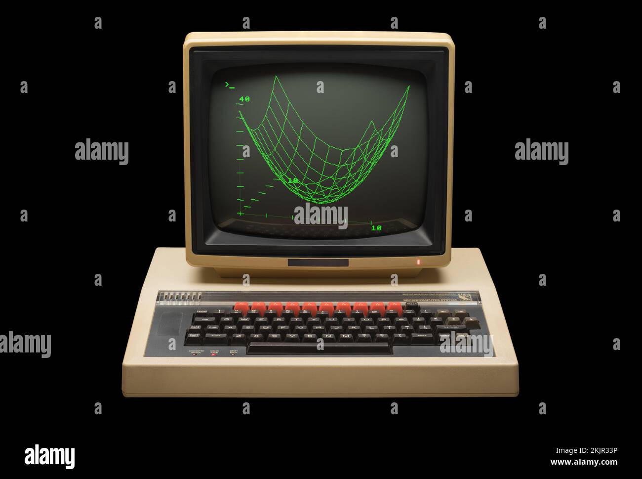 1980s BBC model B microcomputer and green-screen monitor with graphic viewed frontally on a black background Stock Photo