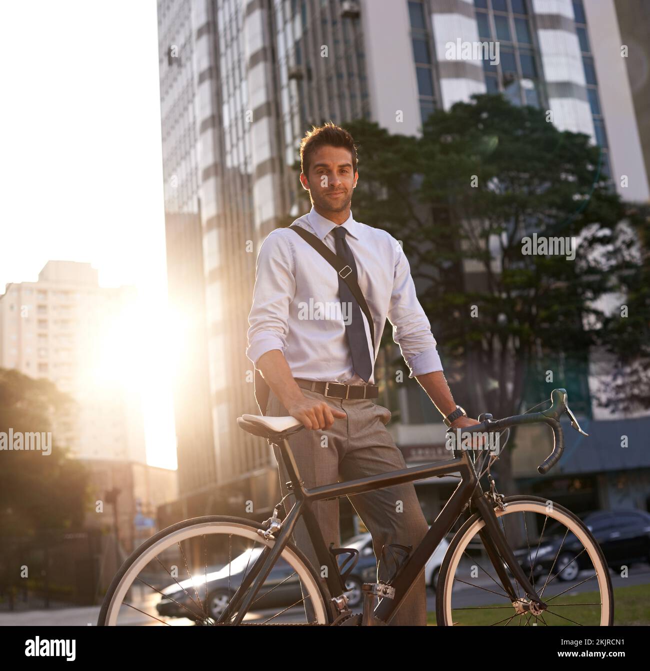 Cycling is the way to go. a businessman commuting to work with his
