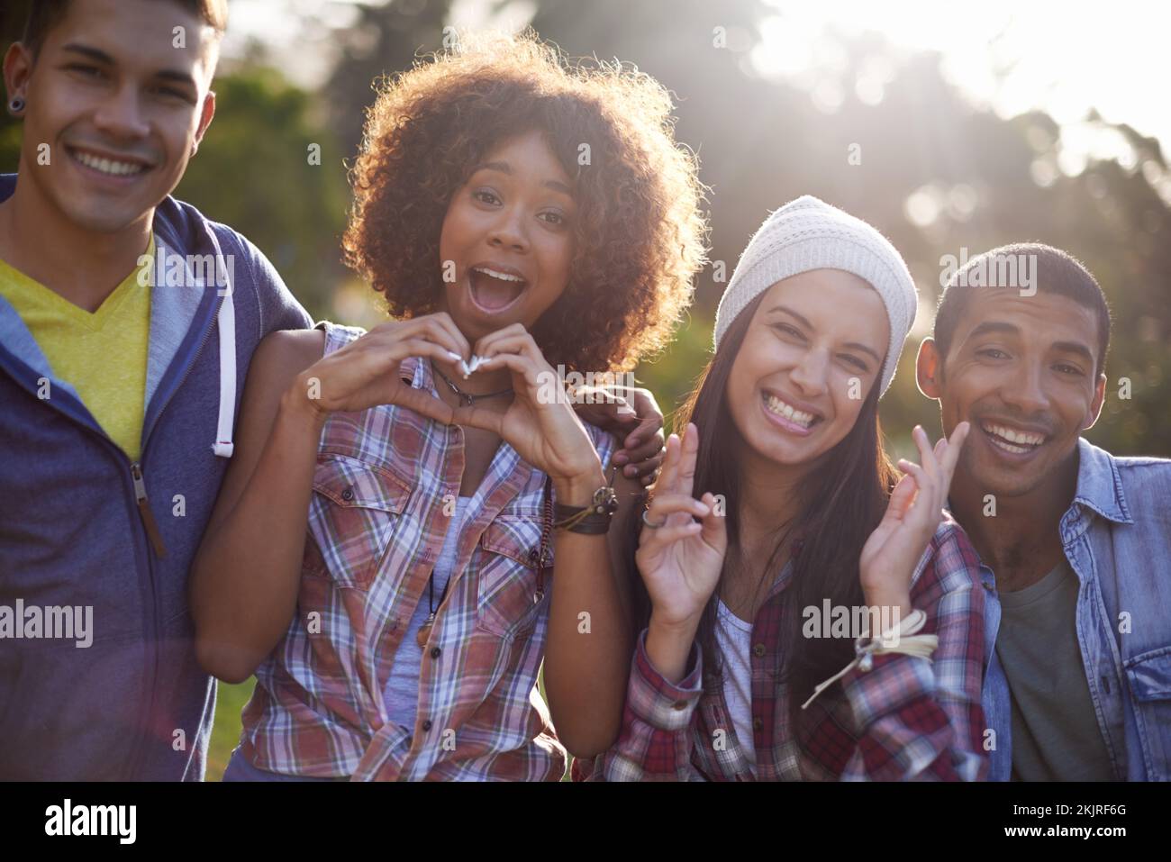 Loving our day in the sun. Cropped portrait of a group of young friends ...