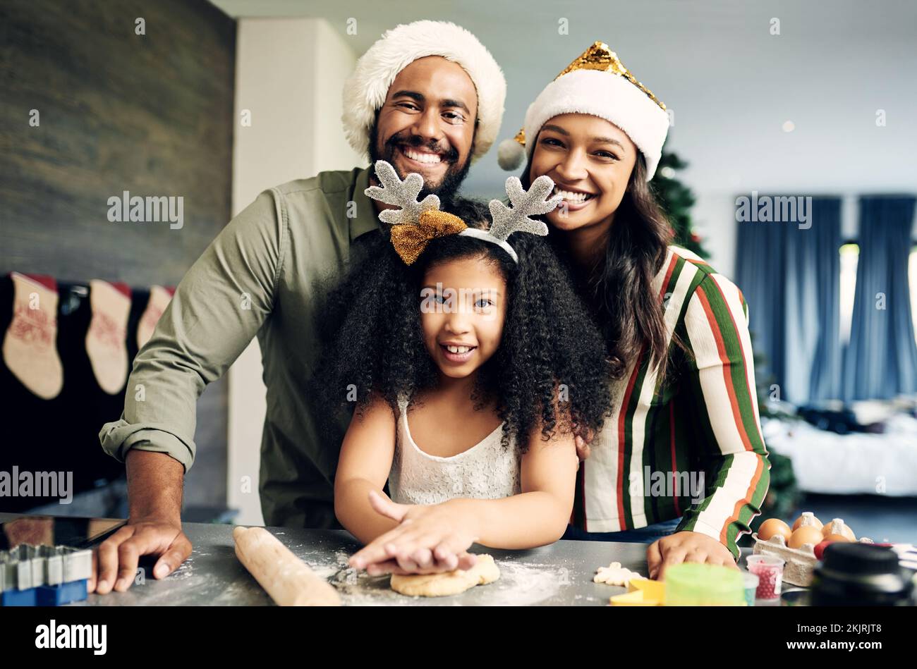 Christmas, portrait and family baking cookies, cake or dessert for a holiday party at their 