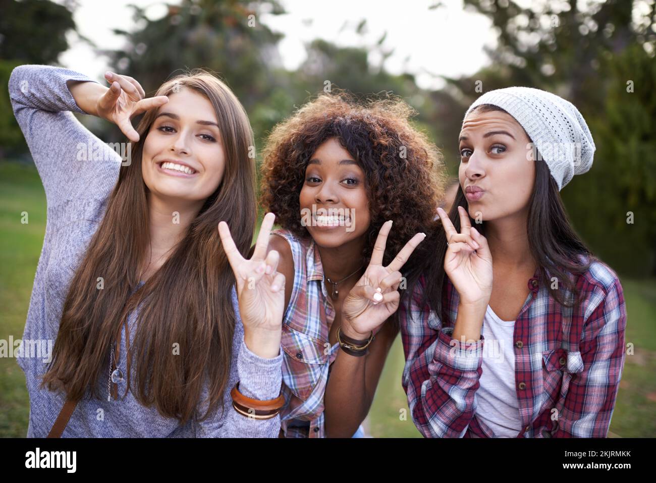 Peace in the park. Cropped portrait of a group of girl friends having fun in the outdoors. Stock Photo