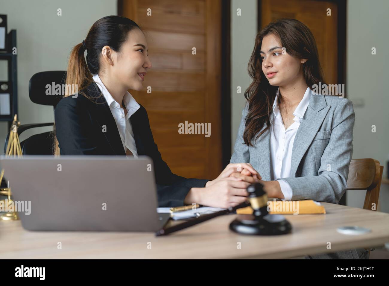 Justice and attorney concept. Lawyer meeting and consoling solution to his client provide legal advice and trust commitment strain serious for problem Stock Photo