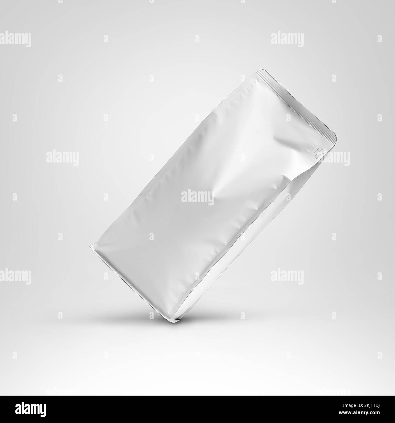 Mockup of a white bag for tea, the package stands diagonally with space for design, pattern, branding. Template stabilo pack with coffee beans, doypac Stock Photo