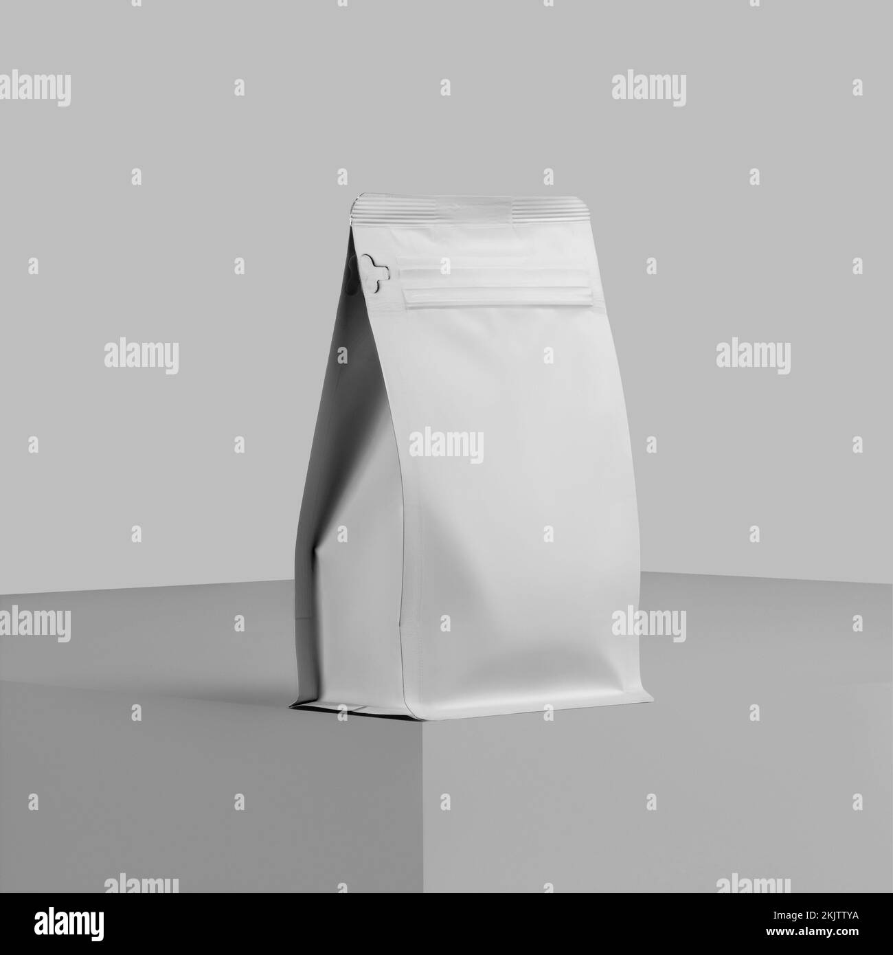 Mockup of a white doy pack for coffee beans, a presentation of zip packaging on a cube, close-up, isolated on a background. Pouch gusset template for Stock Photo