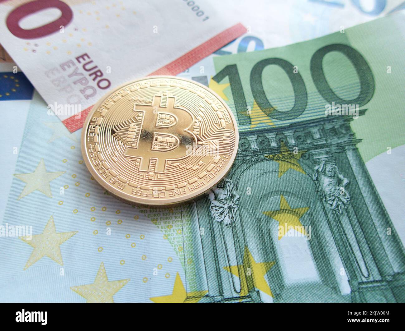 bitcoin concept coin and euro banknotes cryptocurrency impact on economy alternative currency concept Stock Photo
