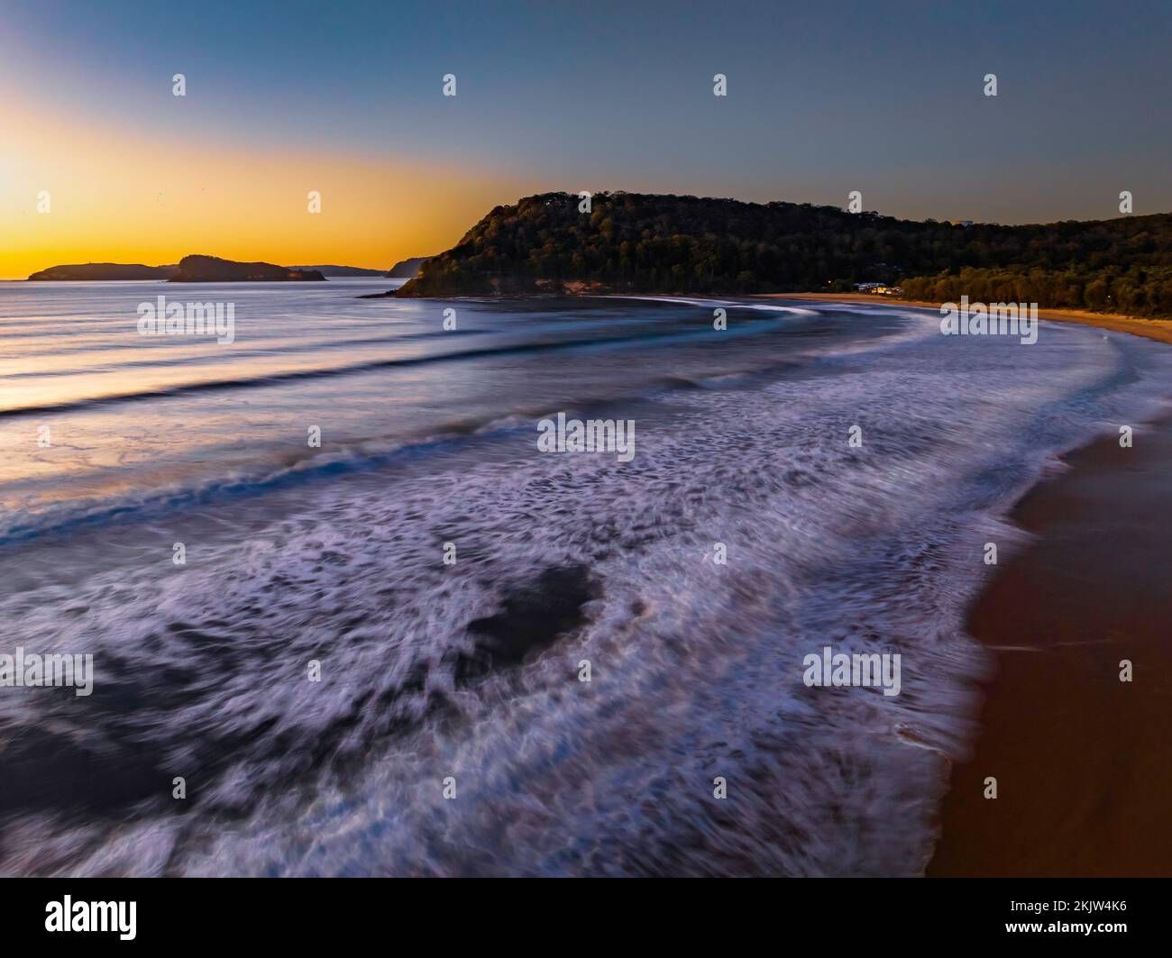 Sunrise at the seaside with clear skies at Umina Beach on the Central Coast, NSW, Australia. Stock Photo