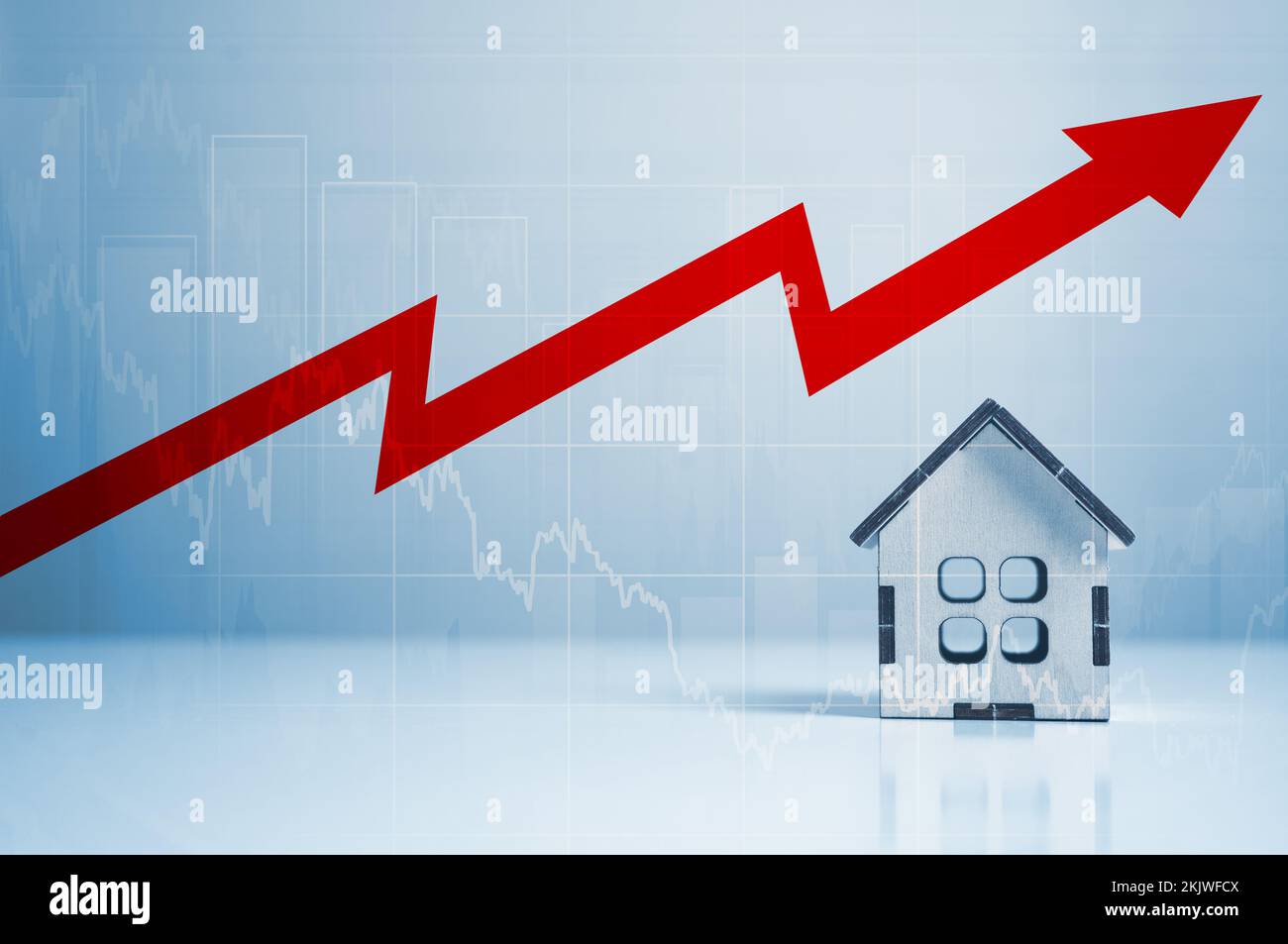 Increasing cost of housing. High demand for real estate. Growth of rent and mortgage rates. Miniature wooden houses and red arrow up. Crisis in rental Stock Photo