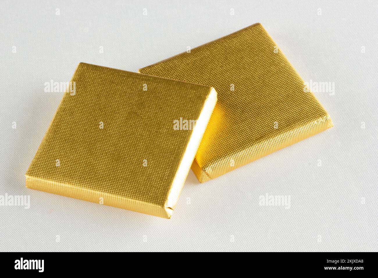 Chocolates wrapped in gold foil Stock Photo - Alamy