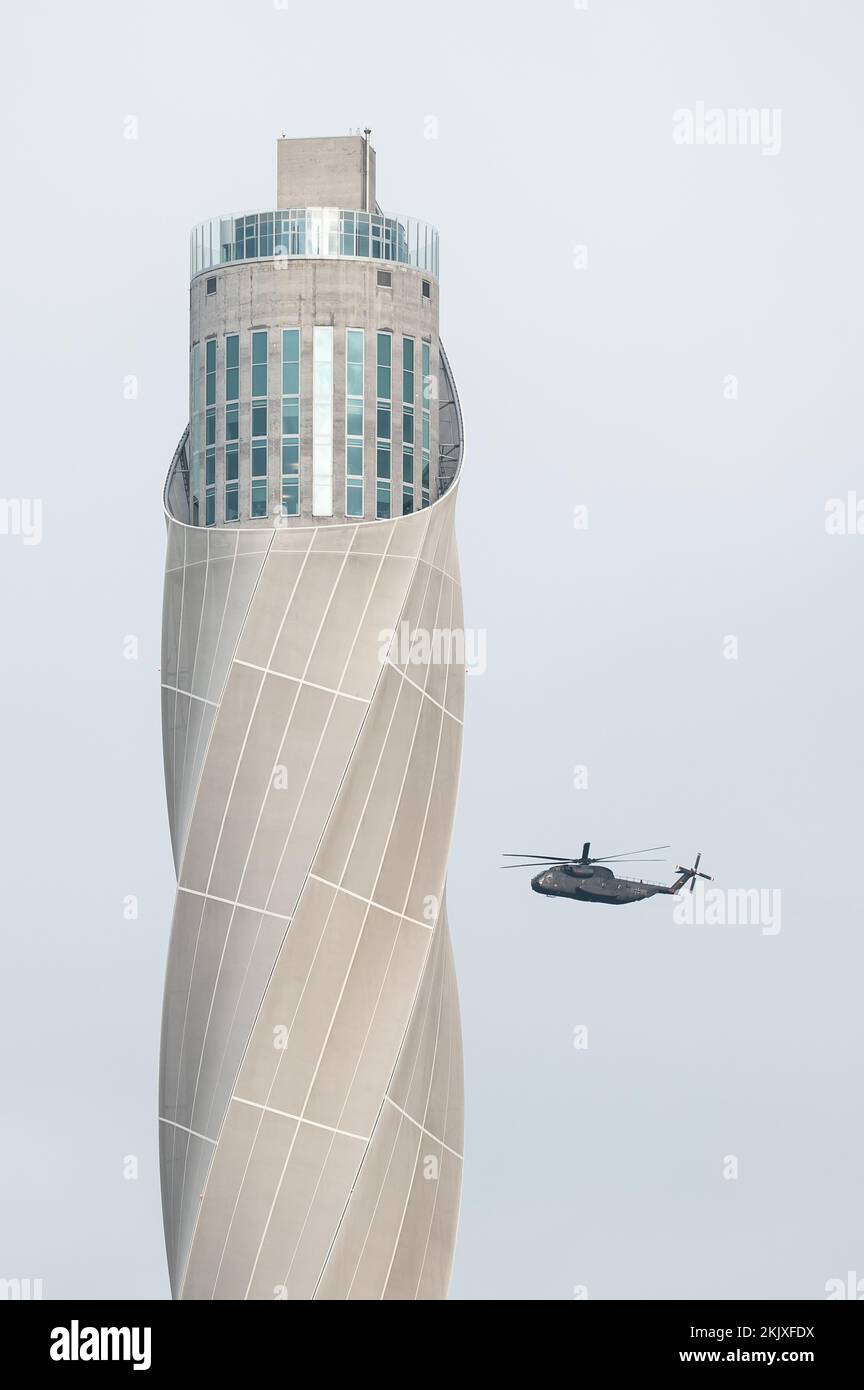 Rottweil, Germany. 25th Nov, 2022. A German Army Sikorsky CH-53 helicopter flies past the TK-Elevator test tower. Credit: Silas Stein/dpa/Alamy Live News Stock Photo