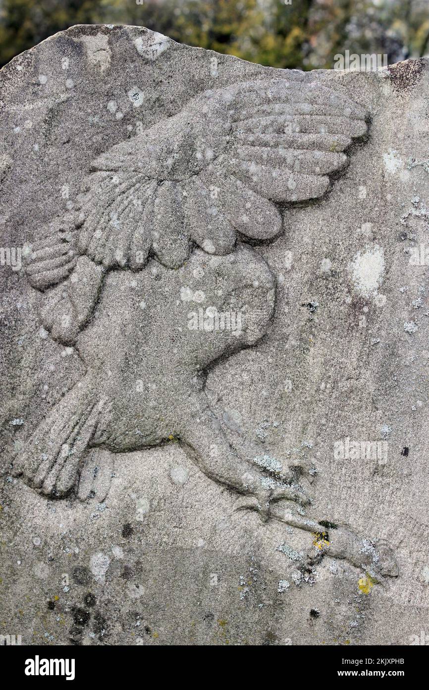 Stone Carving Of A Barn Owl Hunting Mouse Stock Photo
