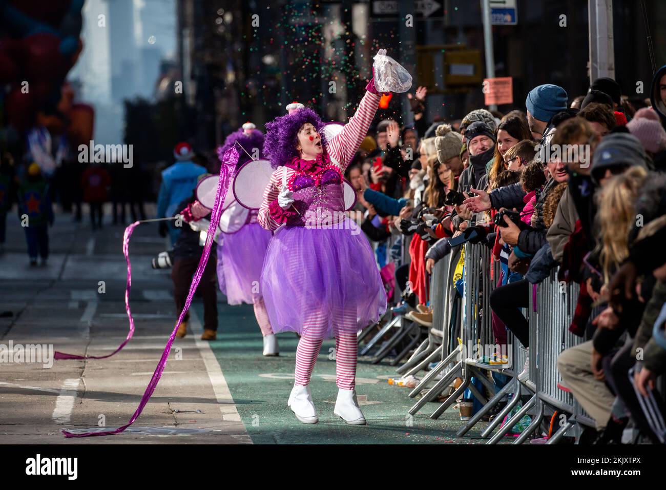 New York, USA. 24th Nov, 2022. A performer throws confetti during the 2022 Macy's Thanksgiving Day Parade in New York, the United States, on Nov. 24, 2022. Credit: Michael Nagle/Xinhua/Alamy Live News Stock Photo