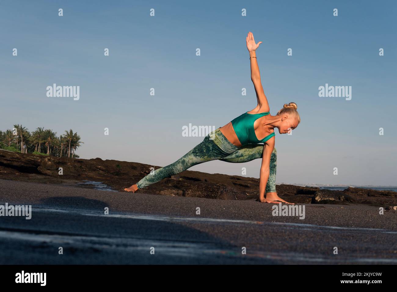 beautiful woman doing yoga on the beach. bali Stock Photo