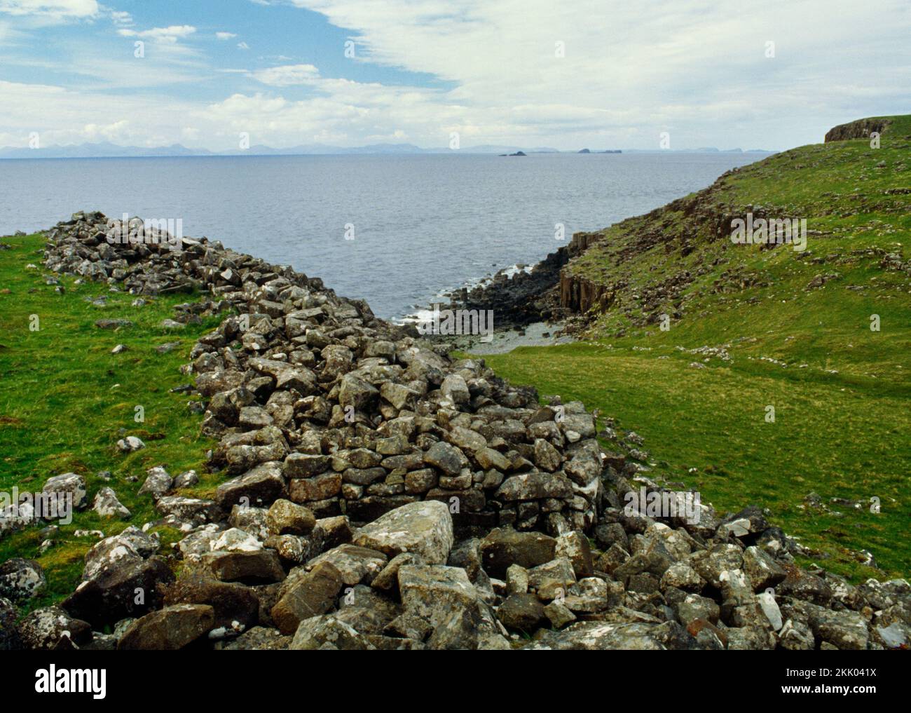 View N along the E wall of Dun Liath Iron Age fort, Kilvaxter, Isle of Skye, Scotland, UK, showing the narrow entrance passage bottom centre. Stock Photo