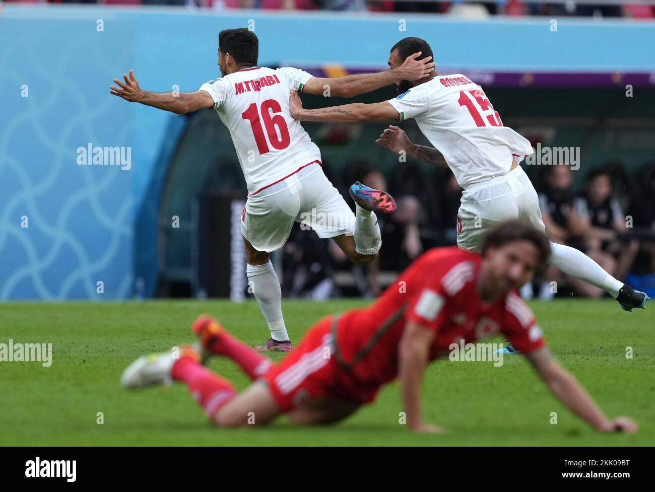 Iran's Roozbeh Cheshmi (right) celebrates scoring their side's first goal of the game during the FIFA World Cup Group B match at the Ahmad Bin Ali Stadium, Al-Rayyan. Picture date: Friday November 25, 2022. Stock Photo