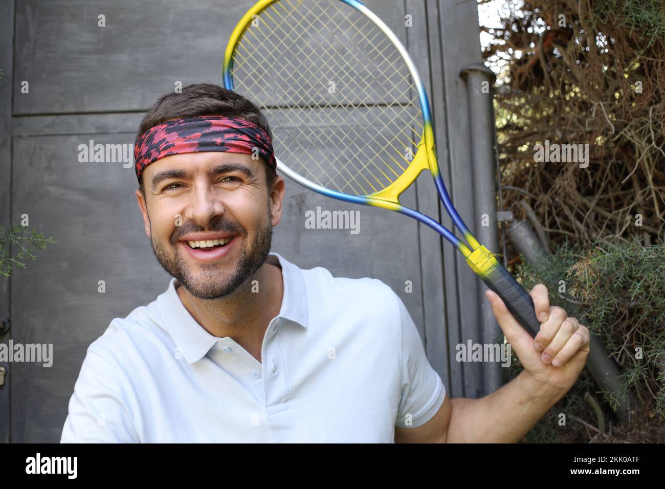 Tennis player with headband and polo shirt portrait Stock Photo Alamy