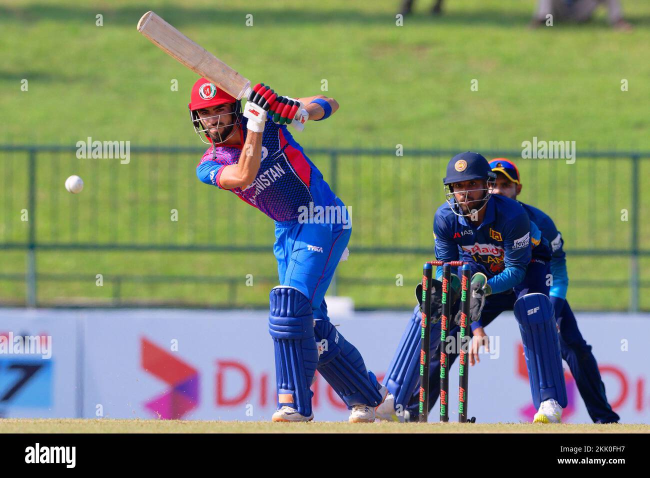 Kandy, Sri Lanka. 25th November 2022. Afghanistan's Ibrahim Zadran watches the ball after